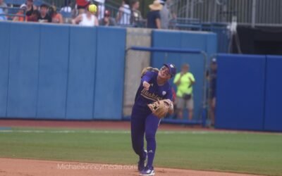 Holtorf leads Huskies past Utes in delayed WCWS opener